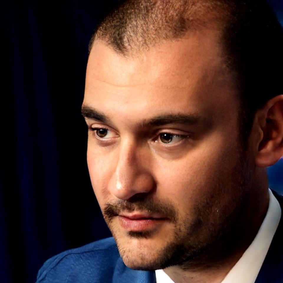 Investment instructor reviewing market analysis