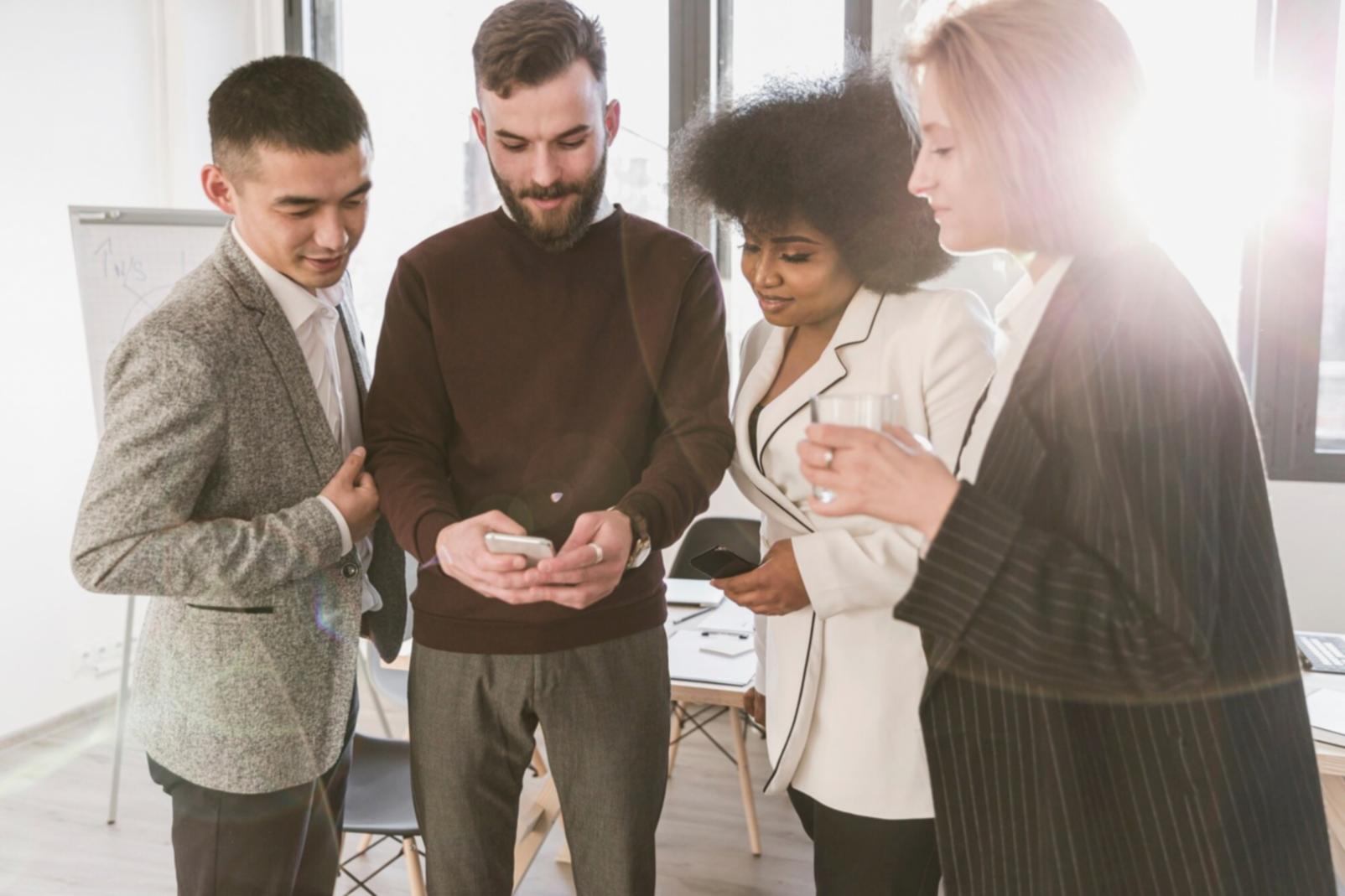 Professional meeting discussing investment strategies with charts and financial documents